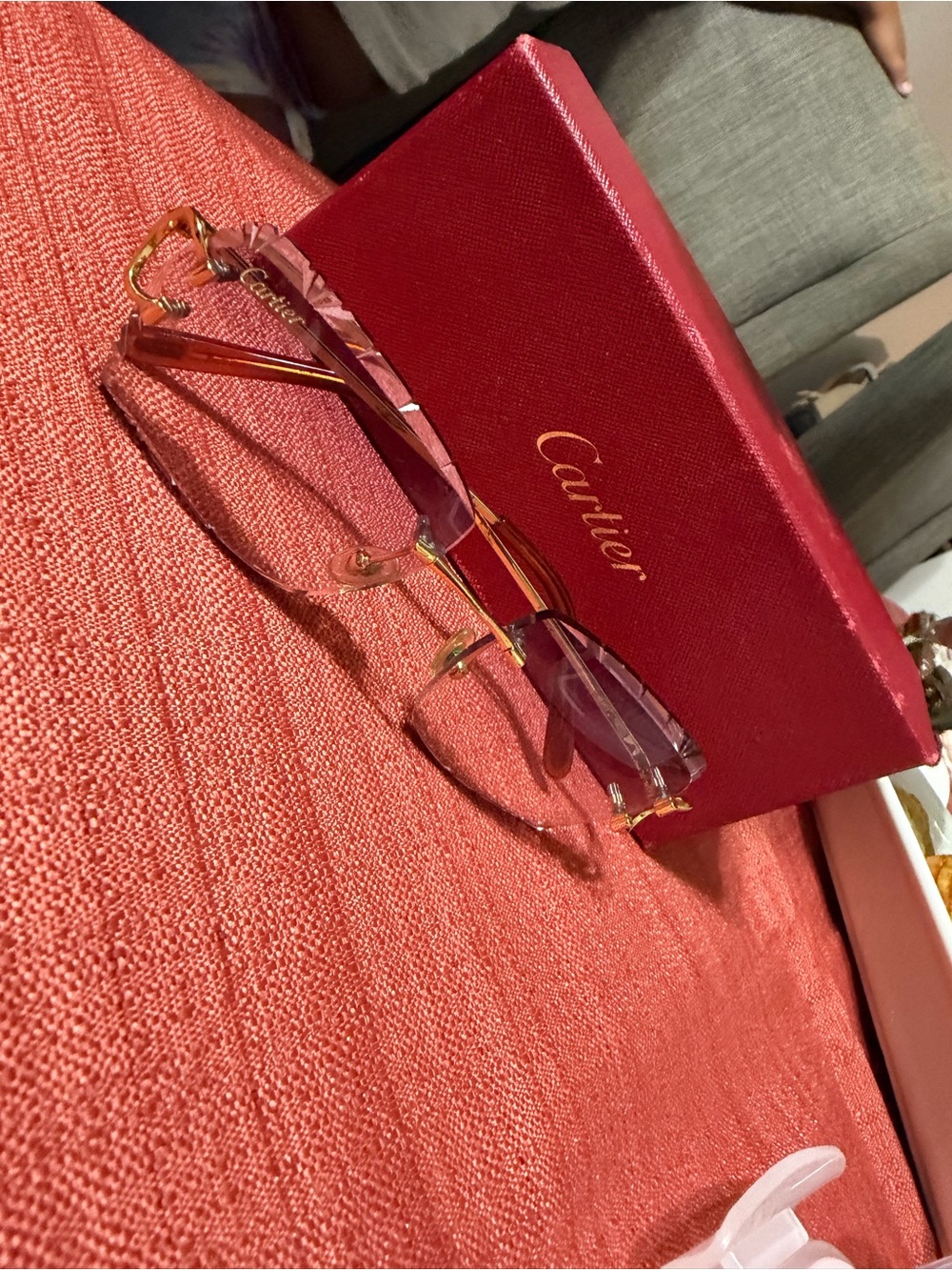Cartier Rimless Glasses with Pink Lenses and Gold Accents